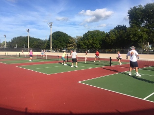 adults playing pickleball on the new outdoor pickleball courts